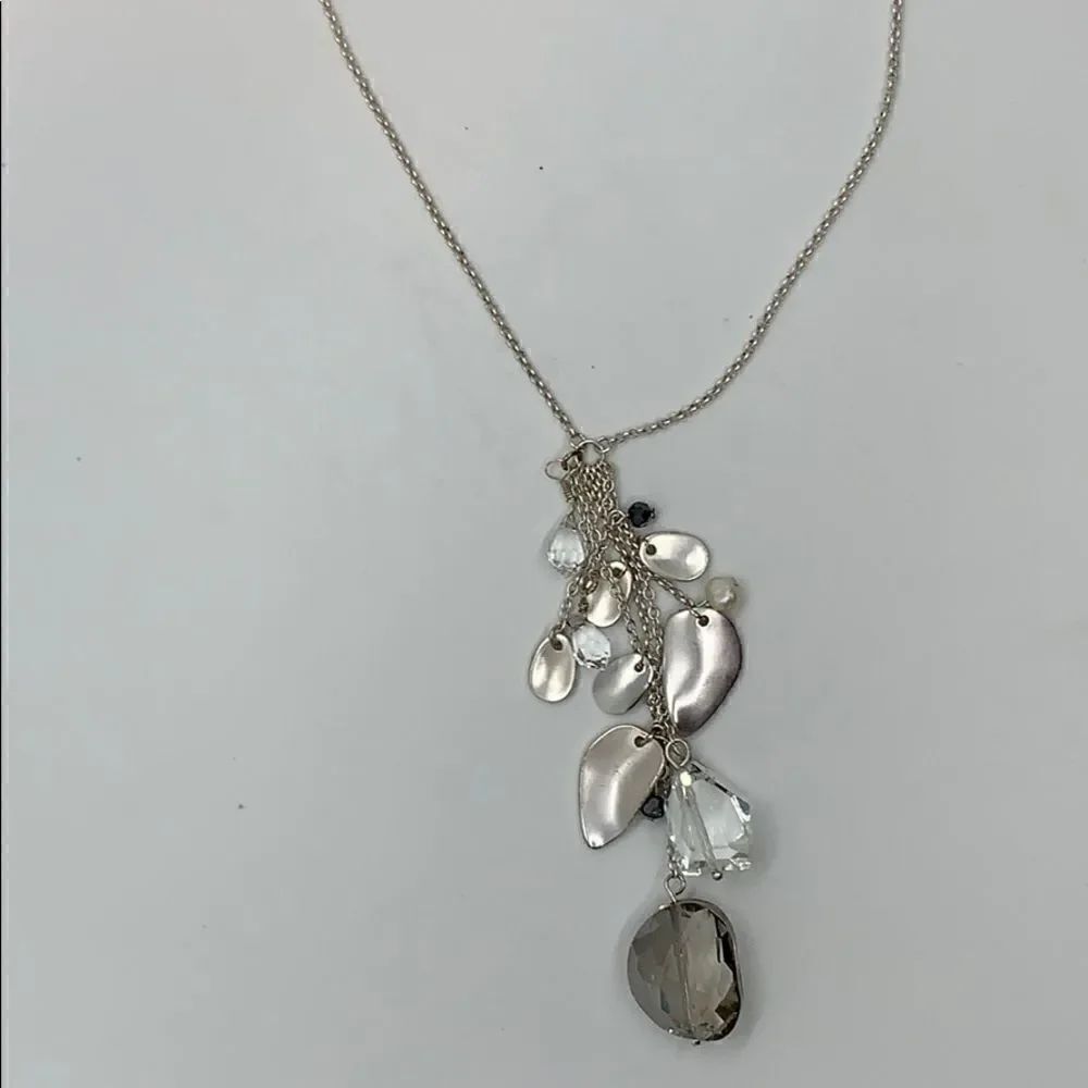 Silver tone and crystal pendant necklace.